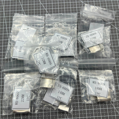 Silver watch strap extenders with secure clasps, perfect for customizing bracelet fit.