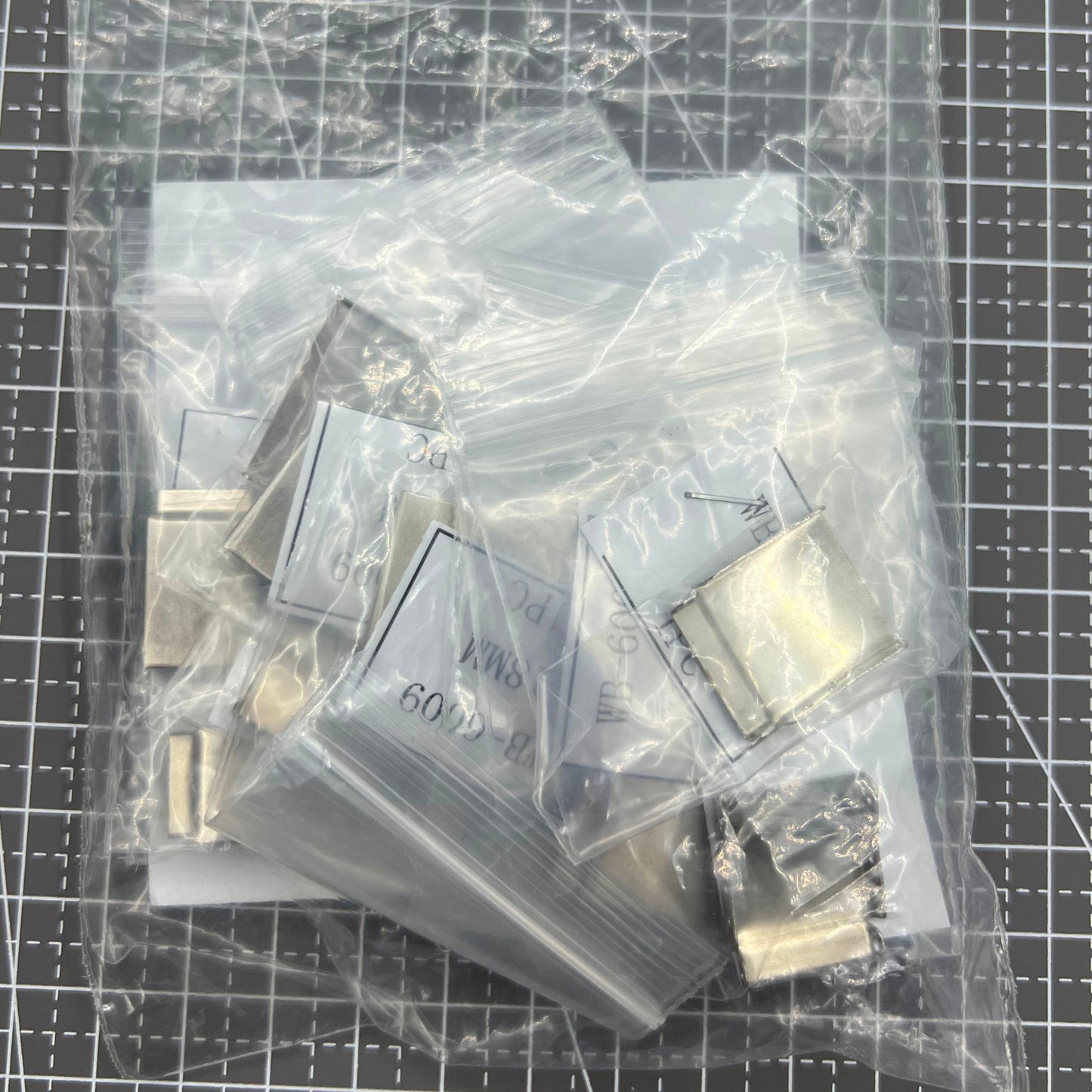 14PCS silver watch strap extenders with clasps, enhancing fit for various watch bracelets.