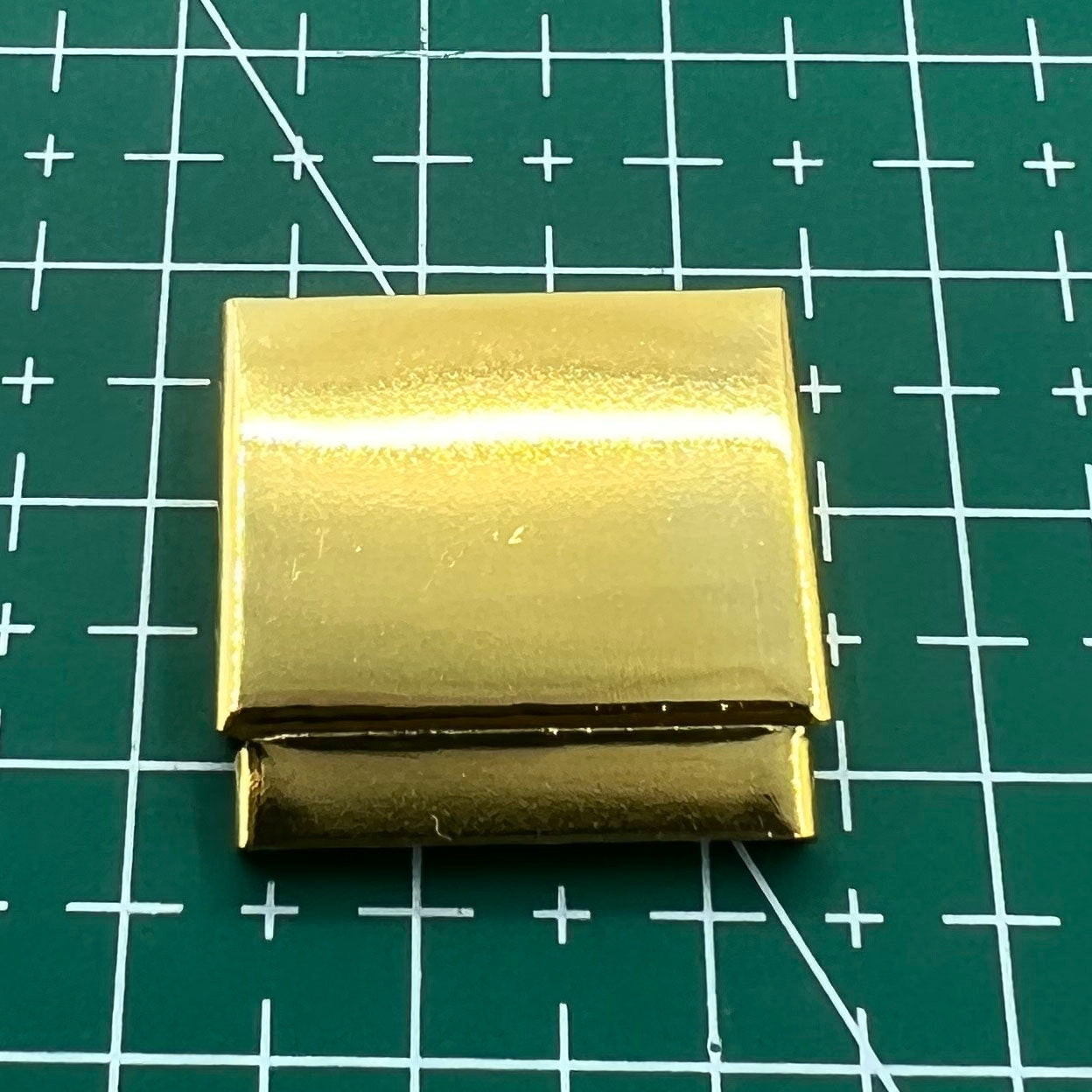 Set of 14 gold-tone watch strap extenders with clasps for adjustable bracelet length, compatible with multiple brands.