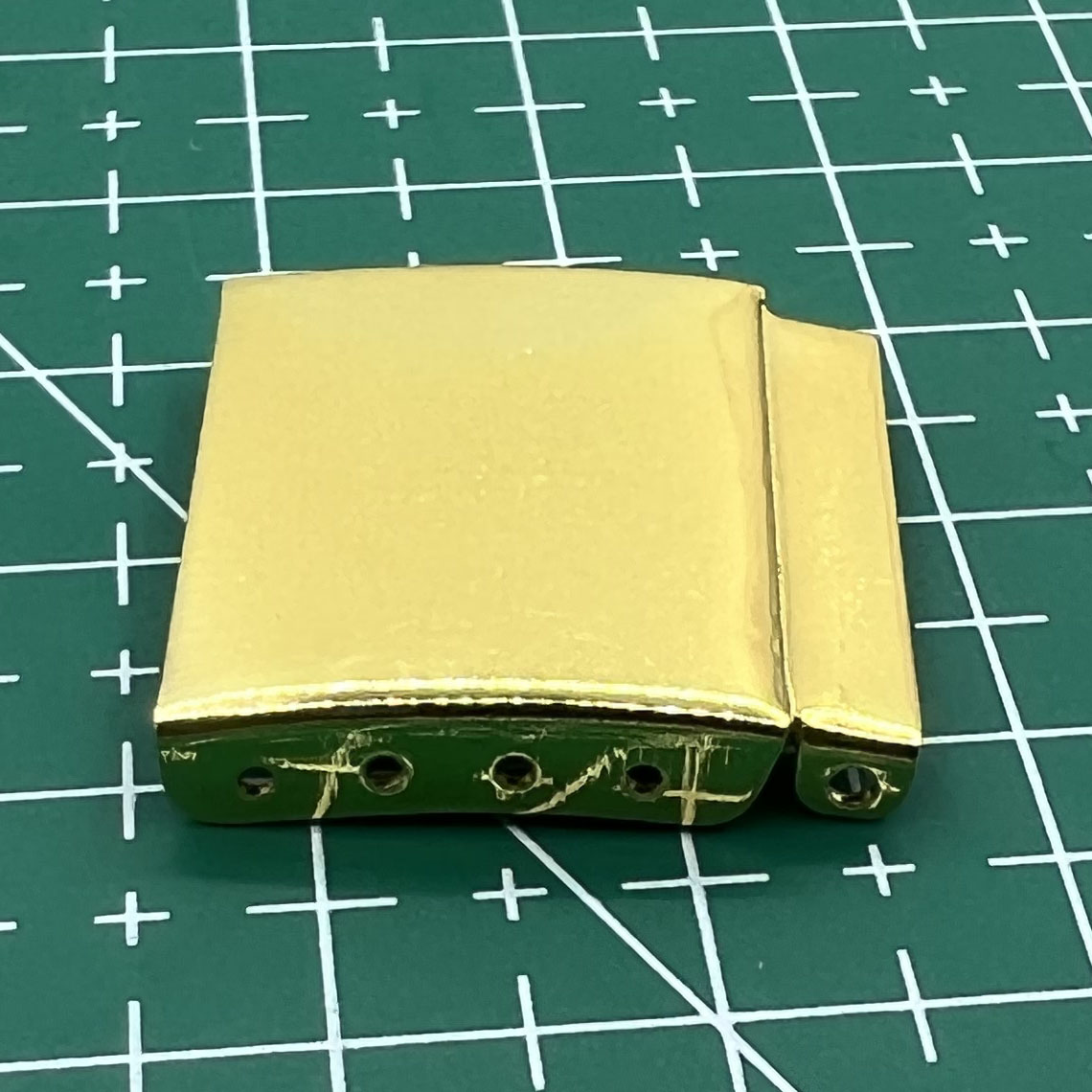 Set of 14 gold-tone watch strap extenders with clasps for adjustable bracelet length, compatible with multiple watch brands.