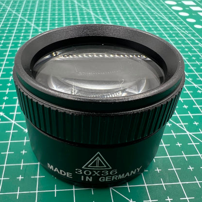 Black 30X magnifier loupe, ideal for precise watch repair and jewelry crafting.