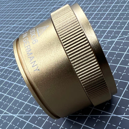 Bright golden 30X magnifier loupe, perfect for detailed watch repair and jewelry inspection tasks.