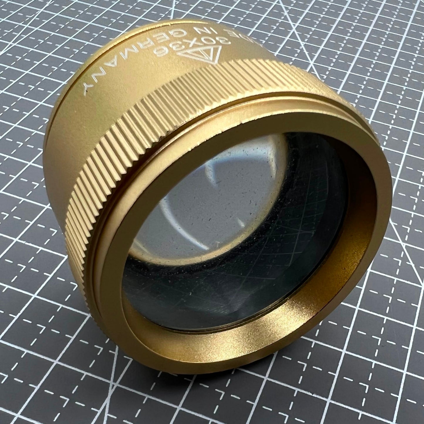 Germany-made bright golden 30X magnifier loupe, perfect for detailed watch repair and jewelry inspection.