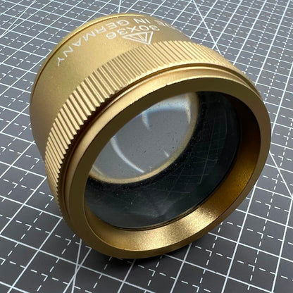 Germany-made bright golden 30X magnifier loupe, perfect for detailed watch repair and jewelry inspection.