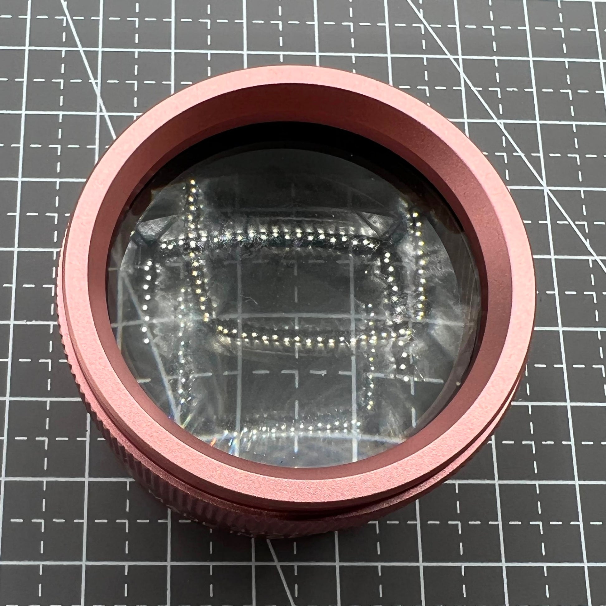 Rose gold 30X magnifier loupe by Germany for detailed watch repair and jewelry inspection.