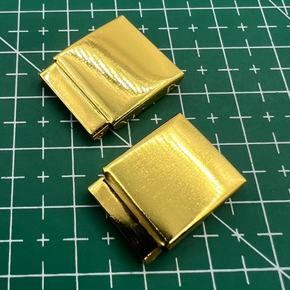 Set of 14 golden watch strap extender links for precise bracelet length adjustment, compatible with multiple brands.