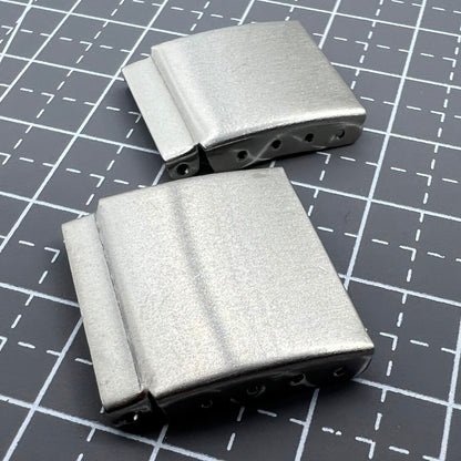 Set of 14 silver watch strap extenders with clasps, ensuring a perfect fit for different bracelets.