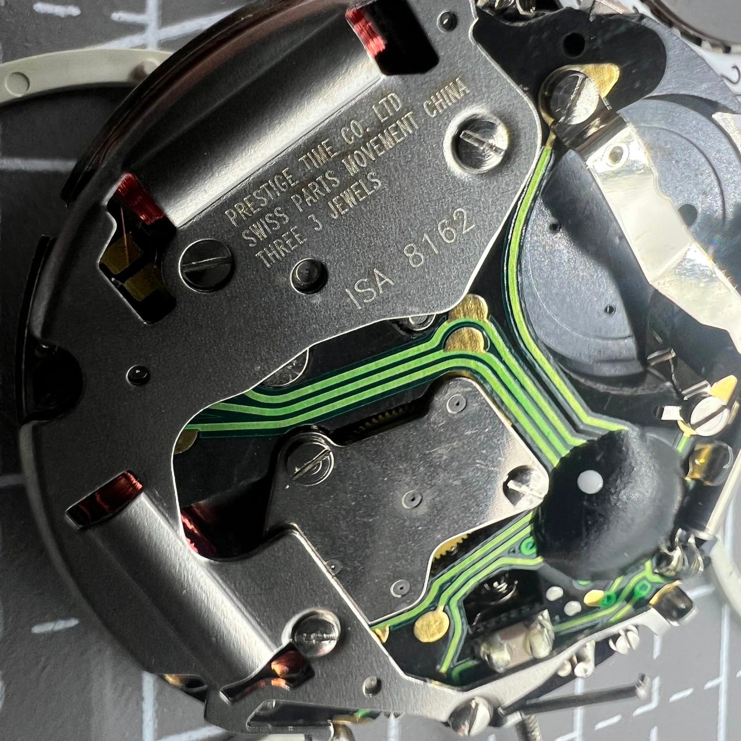 Swiss ISA 8162 quartz watch movement with date at 4, precise replacement for accurate timekeeping.