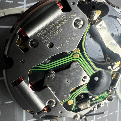 Swiss ISA 8162 quartz watch movement with date at 4, precise replacement for accurate timekeeping.