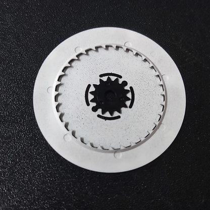 NH36 watch movement with hand-held calendar date disc wheel and day match features.