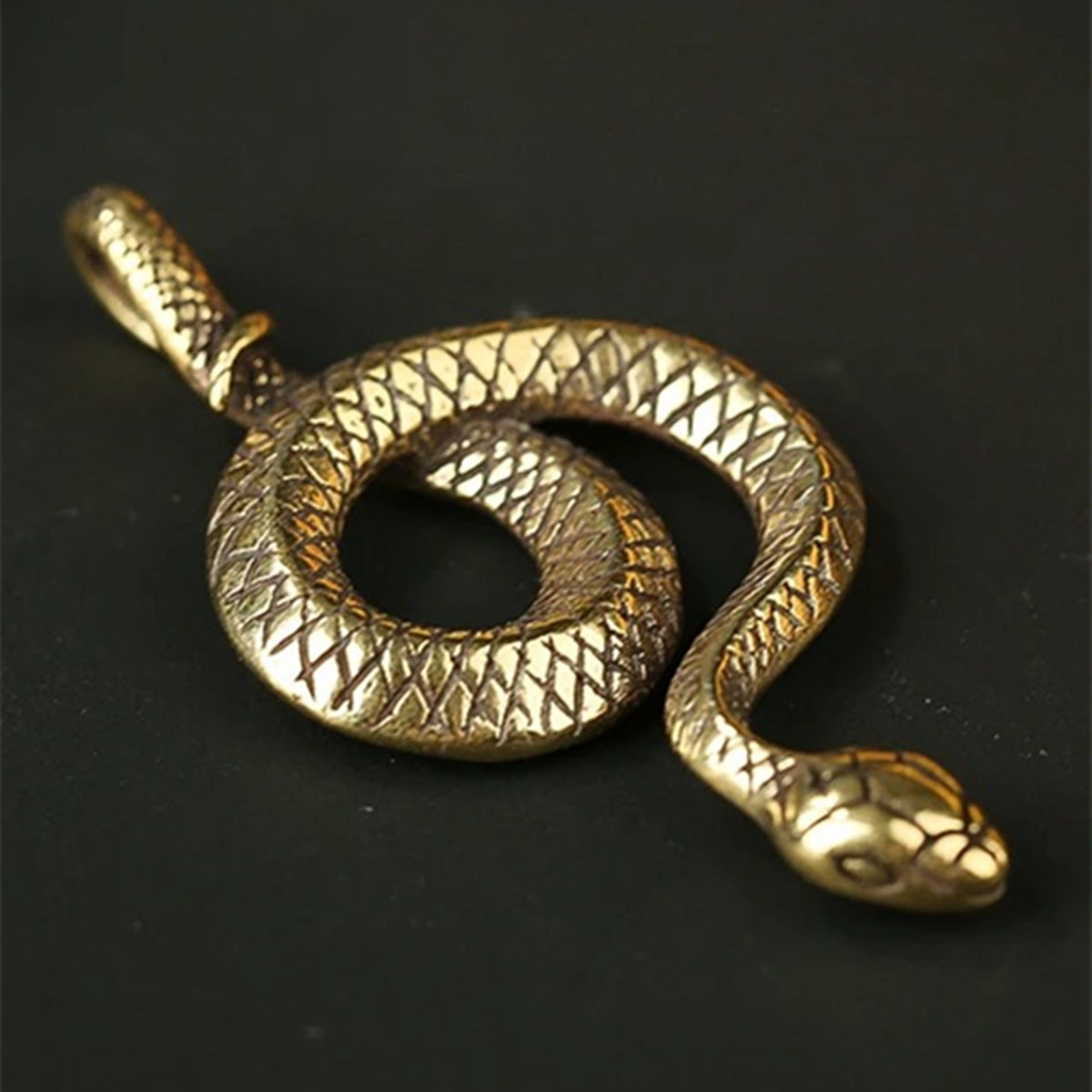 Hand carved vintage bronze snake figurine, solid copper with intricate details.