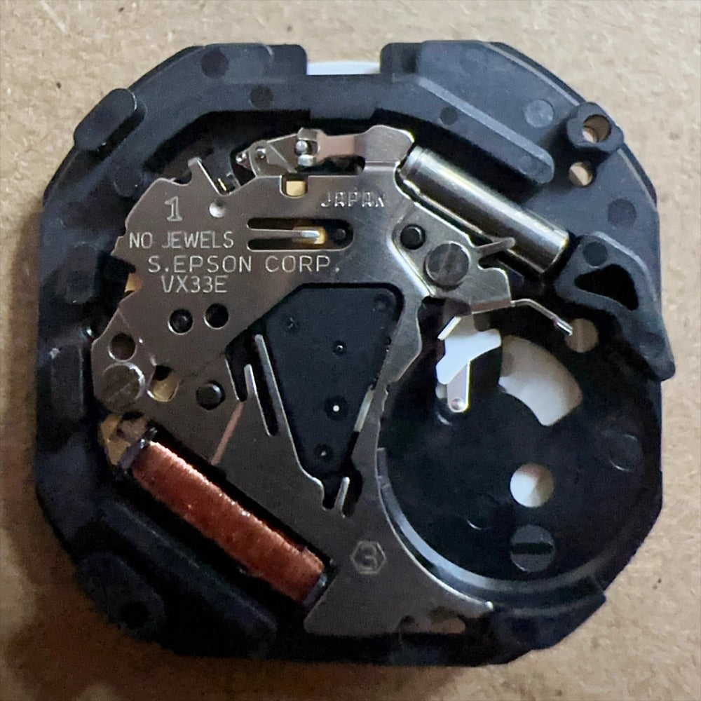 Epson VX33 quartz watch movement with 3 hands and French-English date at 6 o'clock, 3-piece set.