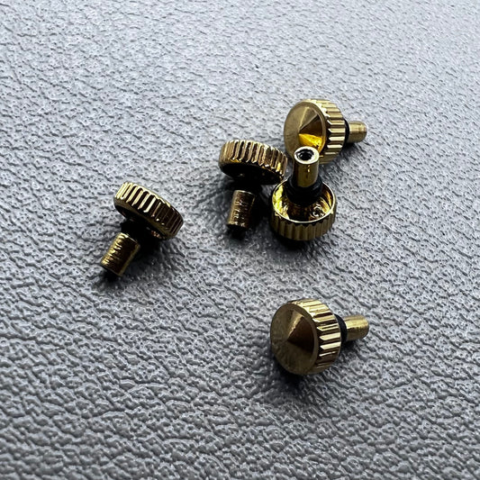 Set of 5 golden watch crowns compatible with Orient watch movements, ideal for stylish repairs.