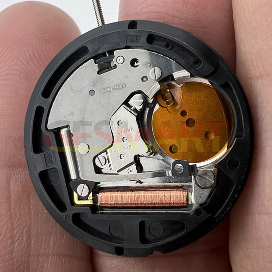 Ronda 517 quartz watch movement showing English & Chinese day and date display at 3 o'clock, Swiss parts.
