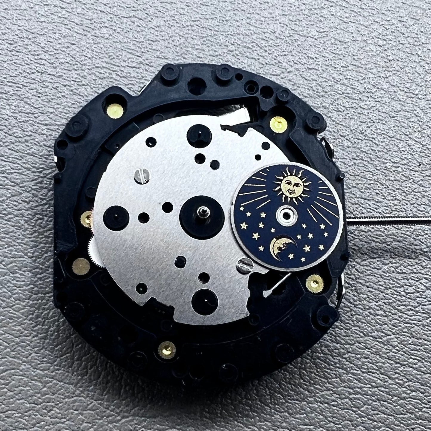 Original Japan VD59 watch movement close-up showing multifunctional quartz small second at 6/9/12 o'clock positions.