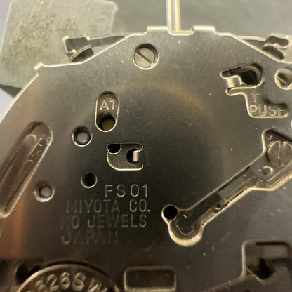 Close-up of Japan Made Miyota FS01 Lady Quartz watch movement repair part showing date display at 4 o?clock position.