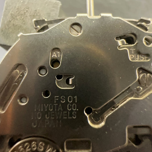 Close-up of Japan Made Miyota FS01 Lady Quartz watch movement repair part showing date display at 4 o?clock position.