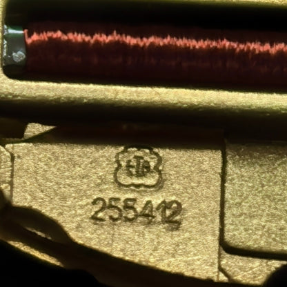 Swiss Made watch accessory featuring ETA255.412 quartz movement with black dial and gold accents.