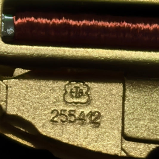 Swiss Made watch accessory featuring ETA255.412 quartz movement with black dial and gold accents.