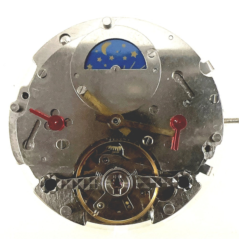 Silver automatic mechanical watch with moonphase at 12, bare balance wheel visible - China made timepiece.