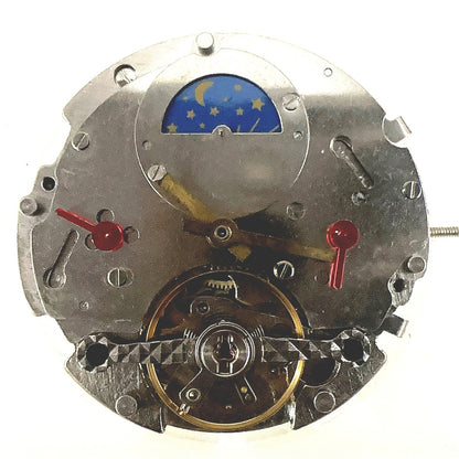Silver automatic mechanical watch with moonphase at 12, bare balance wheel visible - China made timepiece.