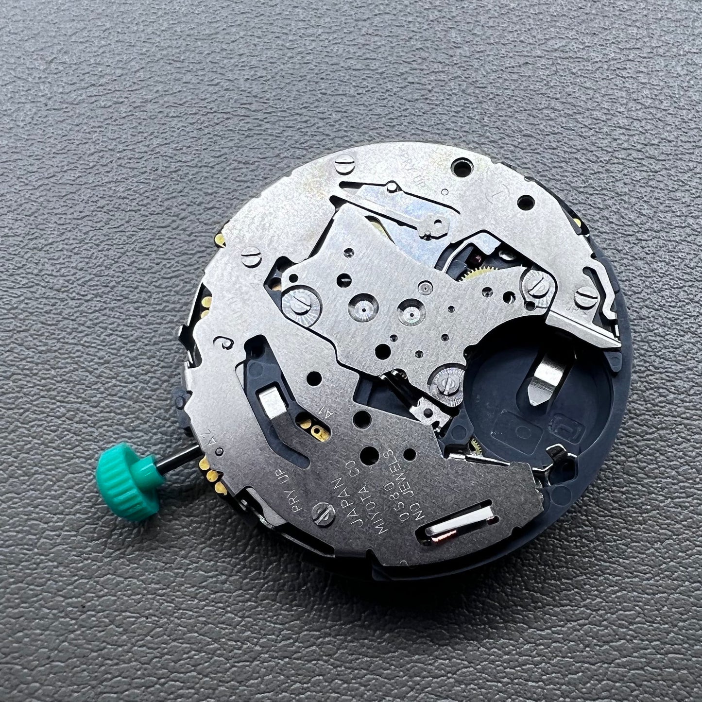 Japan Miyota 0S80 quartz watch movement with date, 1/20 chrono, alarm, and 3 sub-dials for precision timing.
