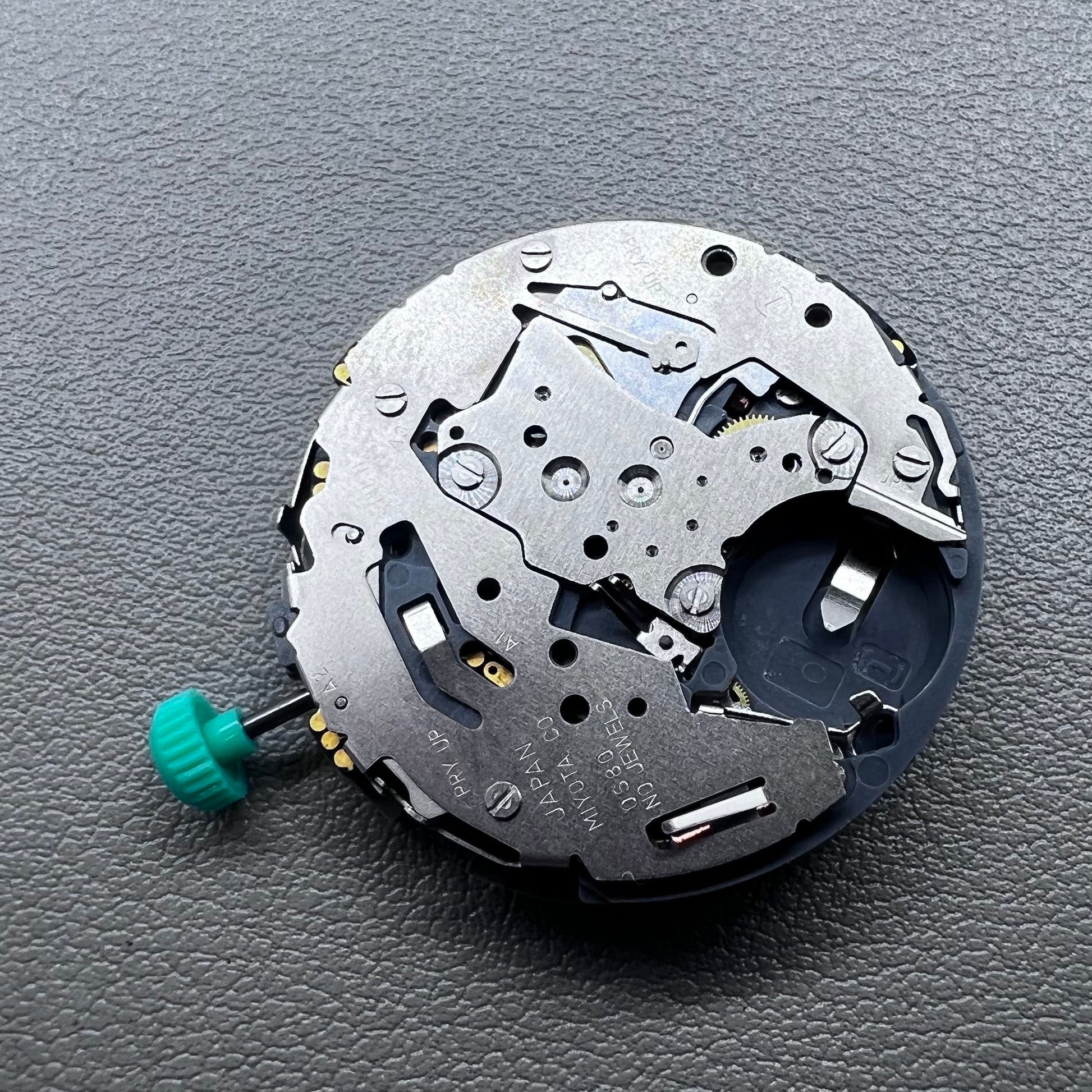 Japan Miyota 0S80 quartz watch movement with date, 1/20 chrono, alarm, and 3 sub-dials for precision timing.