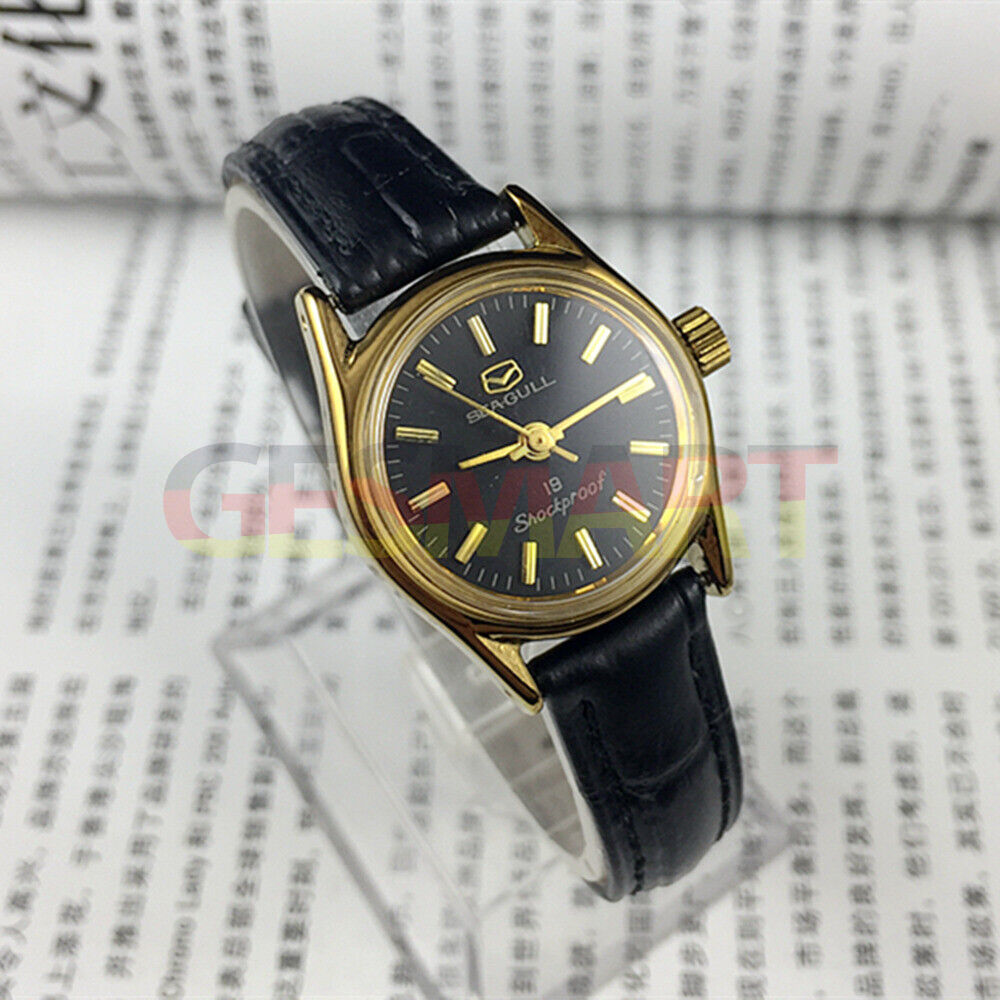 Tianjin Seagull ladies watch with black round case, gold nail markers, and manual mechanical movement.