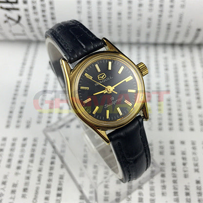 Tianjin Seagull ladies watch with black round case, gold nail markers, and manual mechanical movement.