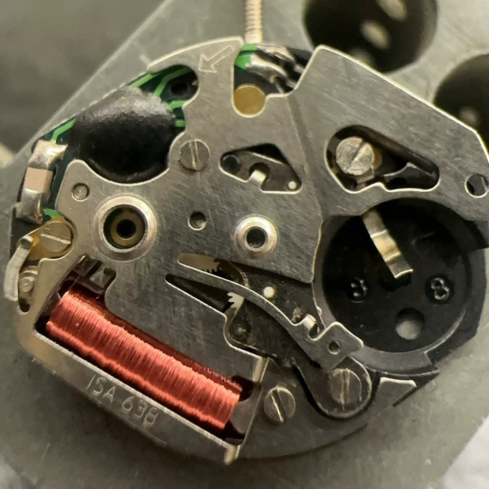 Swiss Made ISA 638 quartz watch part with 3-hand movement, ideal for precise watch repairs and accessories.