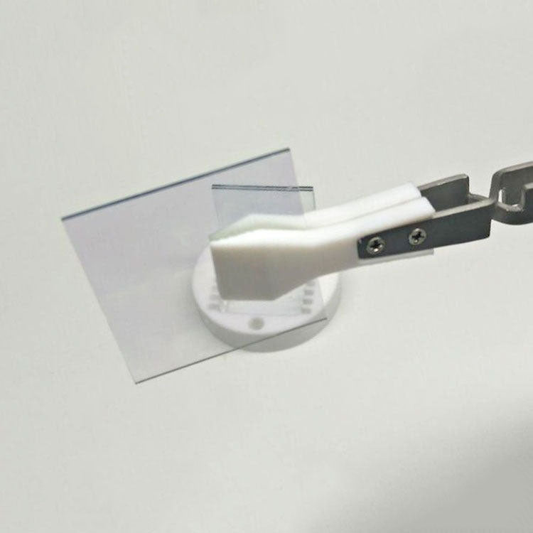 Wide headed PTFE tweezers, acid and alkali resistant, reverse self-locking for secure handling.