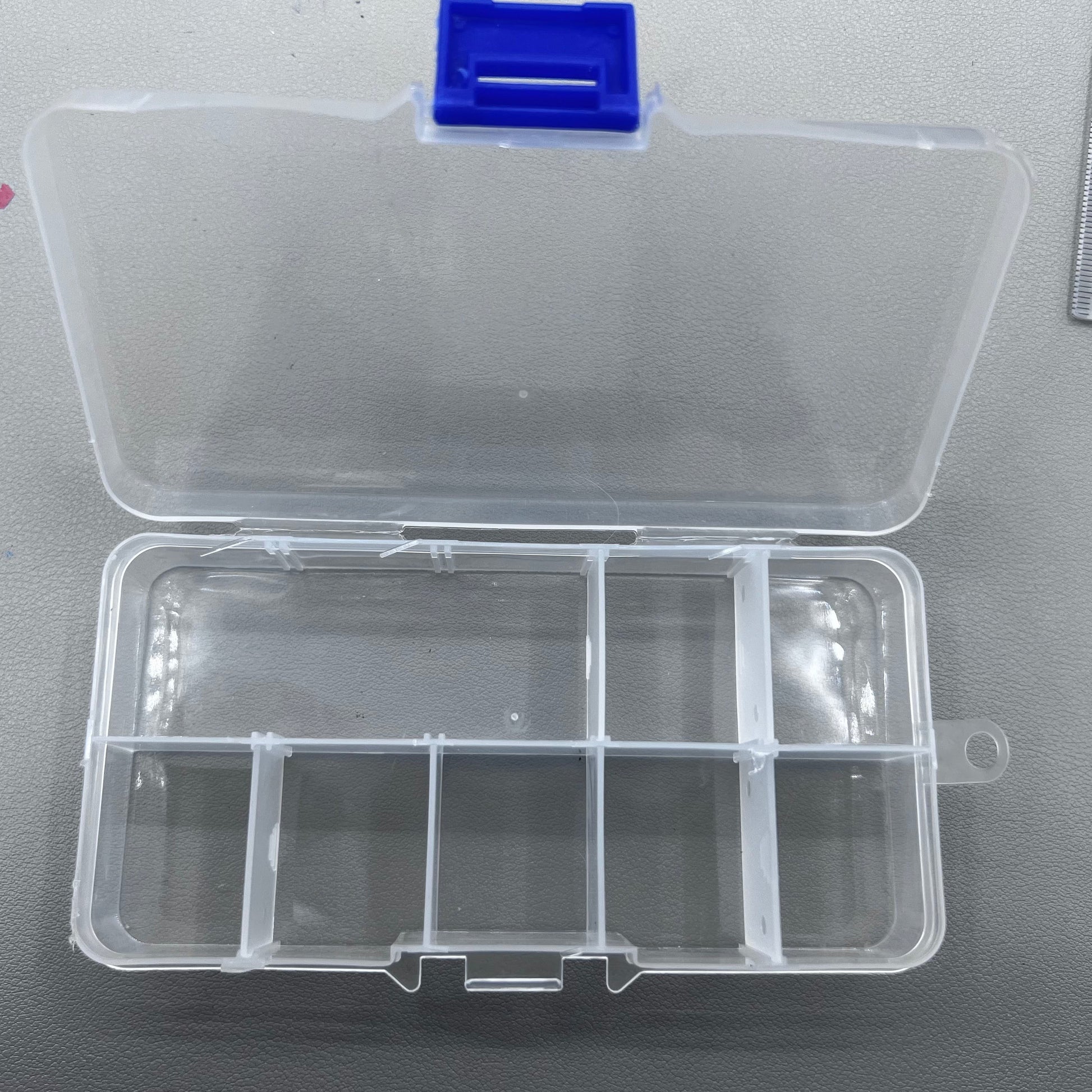 Set of 5 transparent rectangular plastic boxes, ideal for organizing watch parts securely.