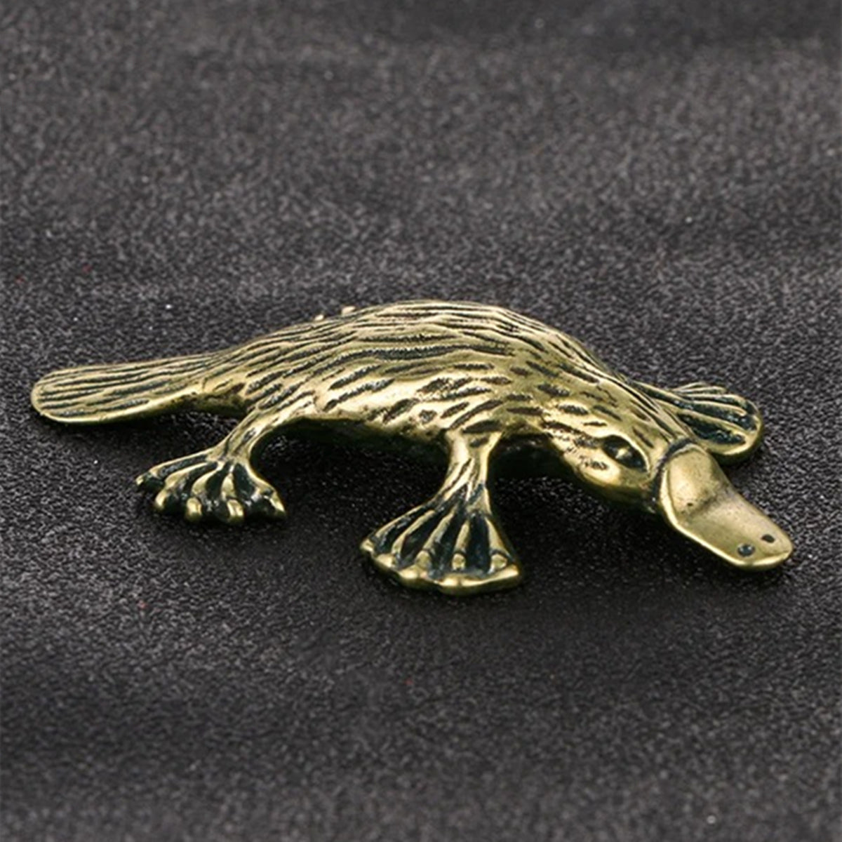 Hand-carved solid copper platypus trinket with vintage bronze finish, collectible decor.