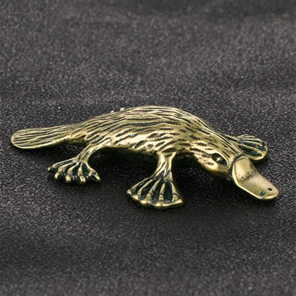 Hand-carved solid copper platypus trinket with vintage bronze finish, collectible decor.