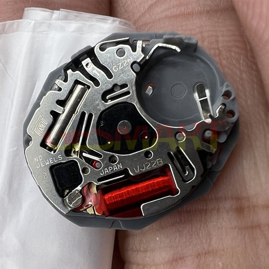 Hattori Epson TMI VJ22 quartz watch movement with date display at 3/6, made in Japan for precise timekeeping.