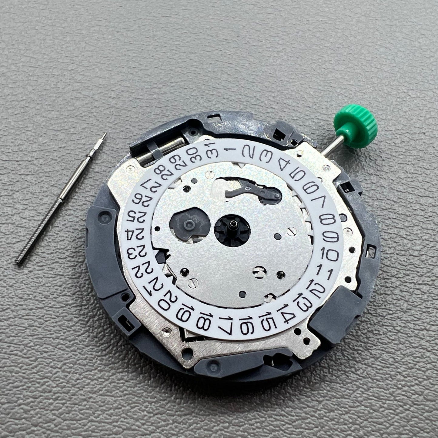 Japan Miyota OS10 quartz watch movement with date display at 3 o'clock, precision timekeeping accessory.