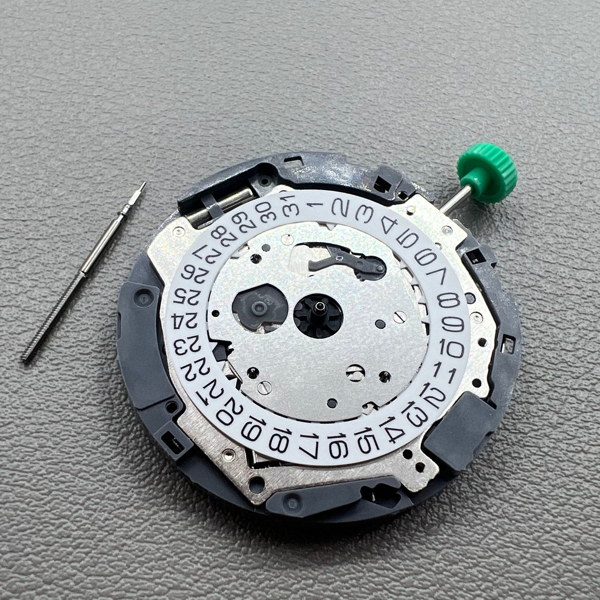 Japan Miyota OS10 quartz watch movement with date display at 3 o'clock, precision timekeeping accessory.