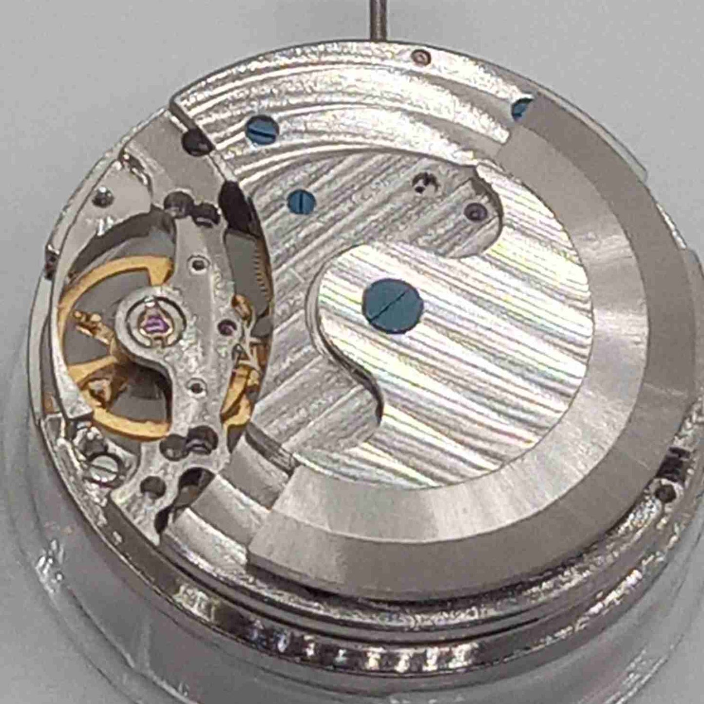 Silver mechanical watch accessory with hollow movement and large 12 o'clock flywheel by China Made.