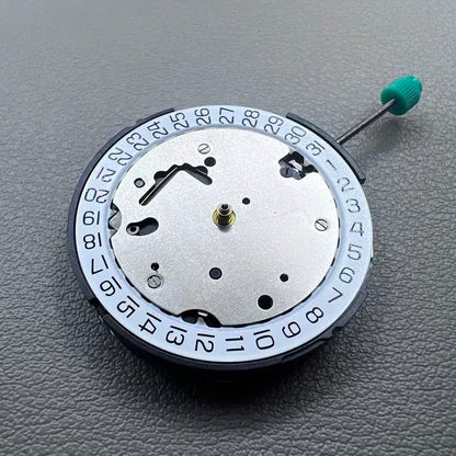 Swiss ISA 8371B quartz watch movement with date at 3 o'clock, white disk, silver-plated finish, precision timekeeping.