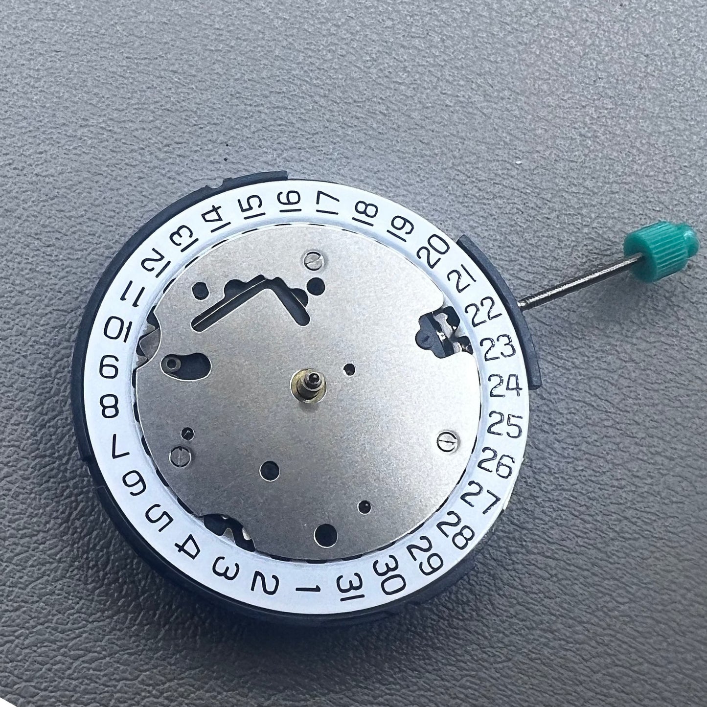 Swiss ISA 8371C quartz movement by ISA, multifunctional watch mechanism for precise timekeeping.
