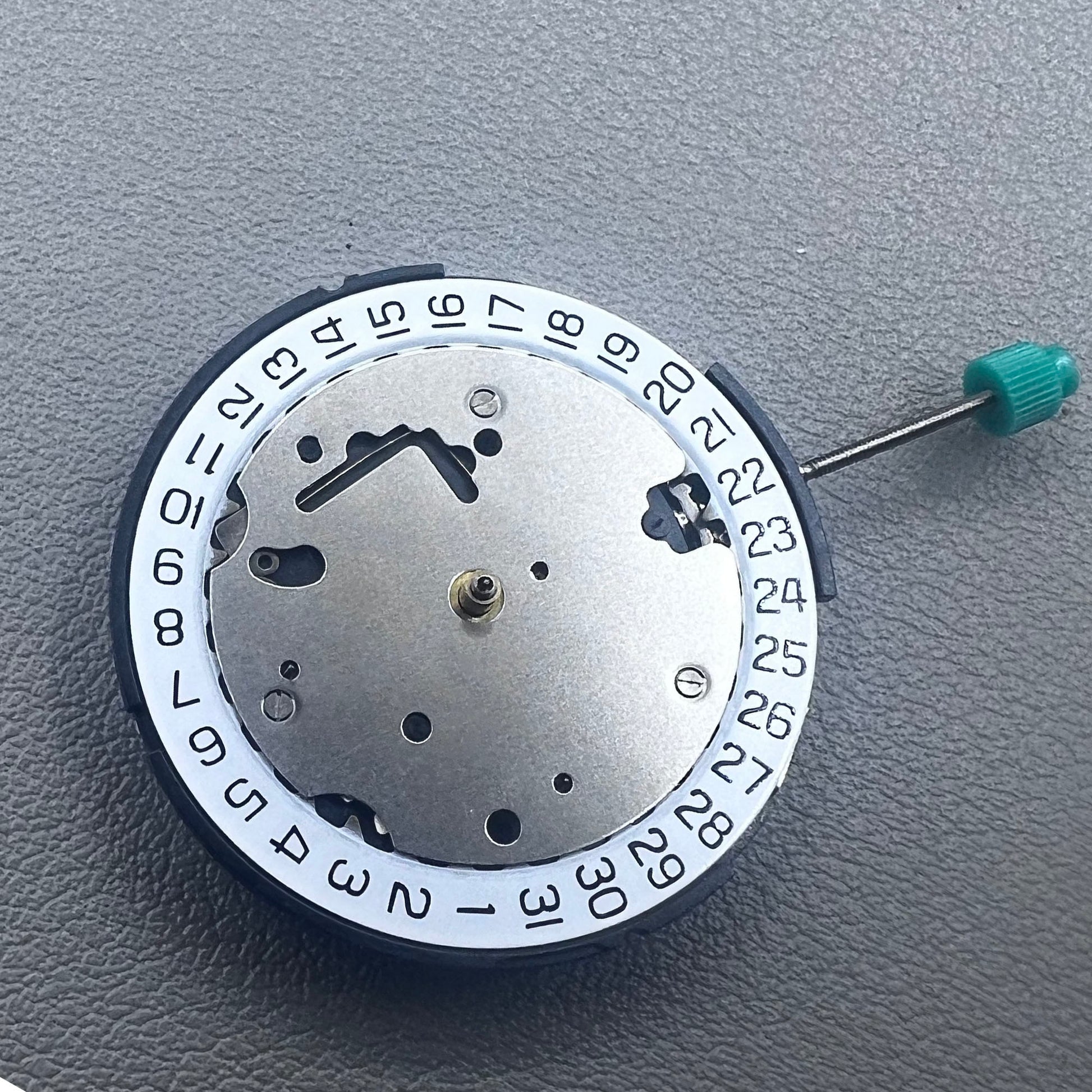 Swiss ISA 8371C quartz movement by ISA, multifunctional watch mechanism for precise timekeeping.