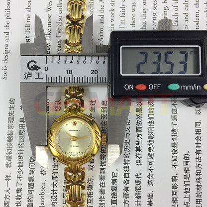 Baoshihua 22mm lady manual watch with 17 jewels and sparkling imitation diamond accents.