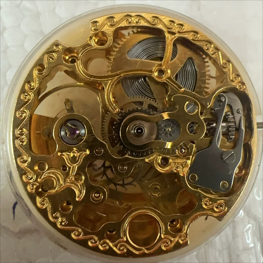 Golden Dandong 7120 mechanical watch part with intricate hollow design, ideal for luxury watch repairs.