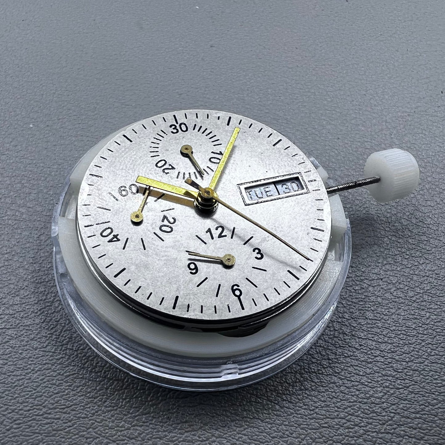 Close-up of Chinese 7750 automatic chronograph movement with day date at 3, ETA 7750 style mechanism
