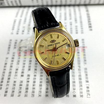 Double Rhomb lady watch featuring a golden dial, manual mechanical movement, and single calendar display by Double Rhomb.