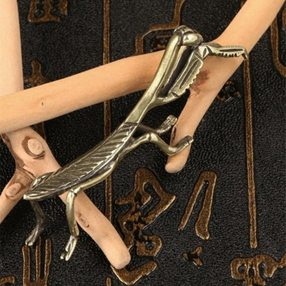 Solid copper mantis trinket with vintage bronze engravings, collectible decor.