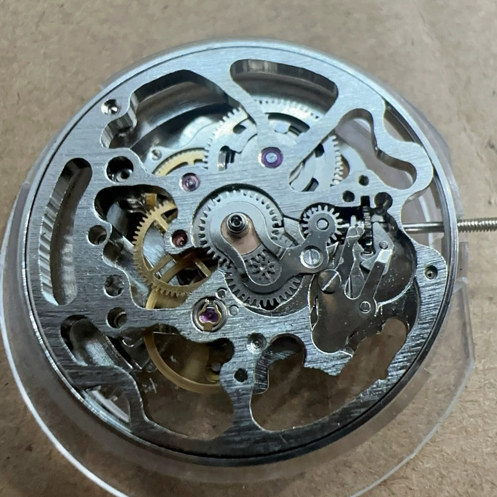 China Made No Calendar Silver 7120 mechanical watch part with 3 hands for precise timekeeping.