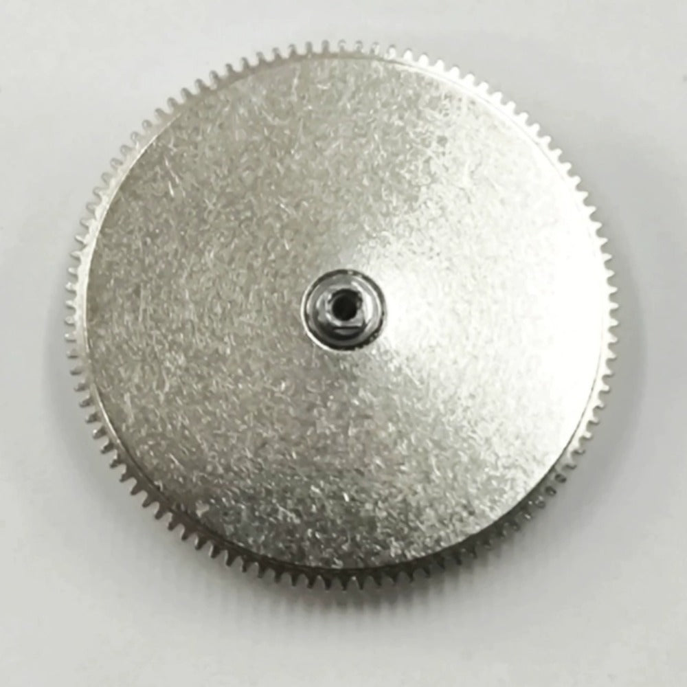 Complete barrel with new mainspring for Dandong 7750 watch movement, premium spare part for repairs.