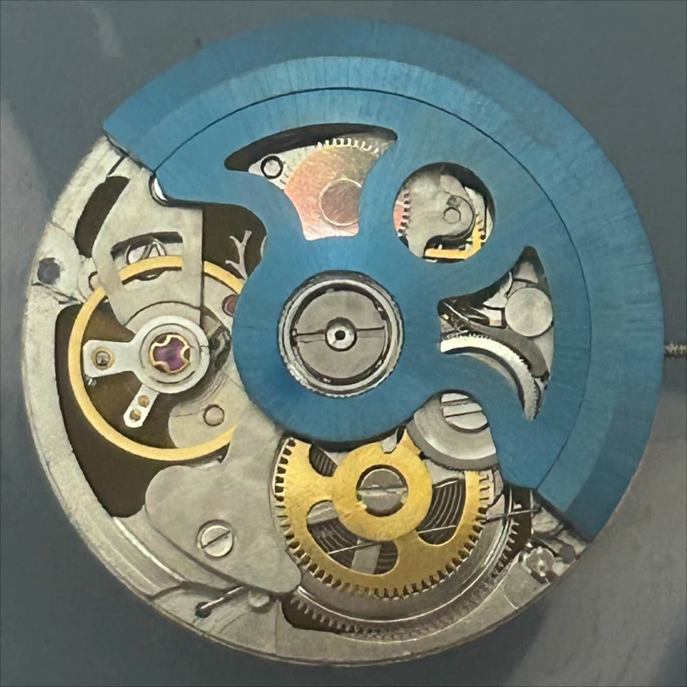 Blue rotor of China Made New 2189 automatic mechanical watch movement with 3 hands, precise timekeeping.
