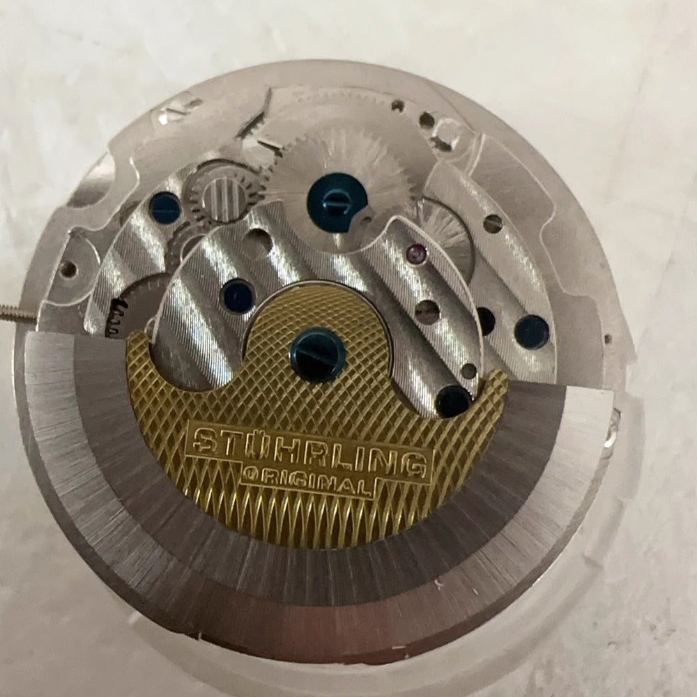 Shanghai Silver mechanical watch with 3 hands, flywheel, small second for elegant timekeeping.